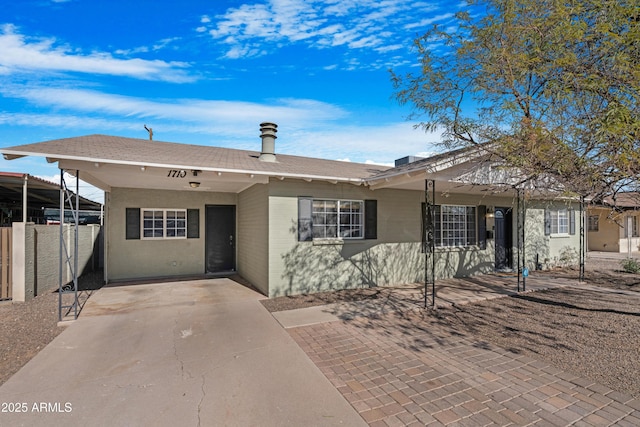 ranch-style house with a carport