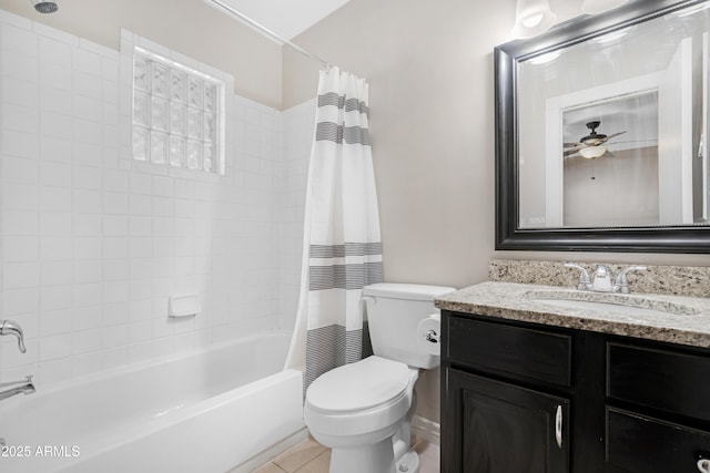 full bathroom with toilet, tile patterned floors, vanity, ceiling fan, and shower / bathtub combination with curtain