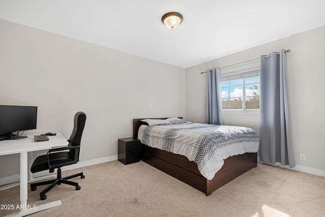 bedroom featuring light colored carpet