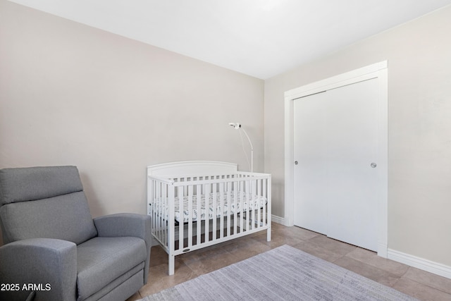 bedroom featuring a nursery area