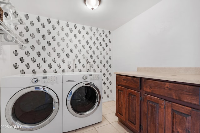 laundry area featuring light tile patterned flooring and washer and dryer