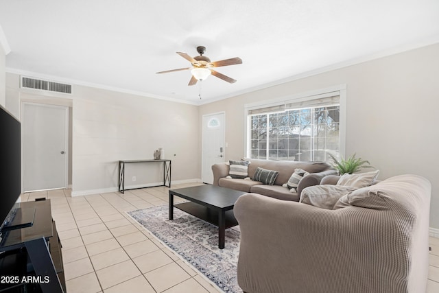 tiled living room with ceiling fan and ornamental molding