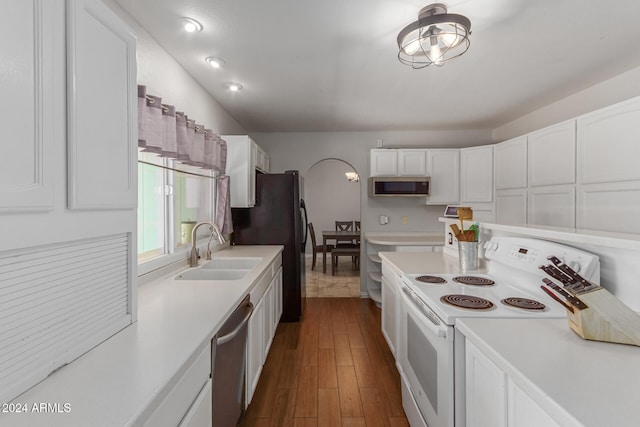 kitchen featuring sink, white cabinets, stainless steel appliances, and dark hardwood / wood-style flooring