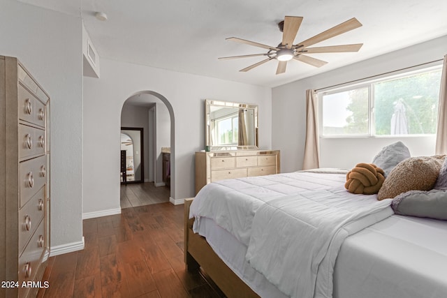 bedroom with dark wood-type flooring and ceiling fan