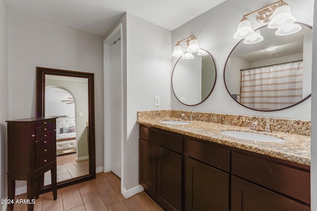 bathroom with vanity and ceiling fan