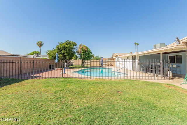 view of yard featuring a fenced in pool and a patio