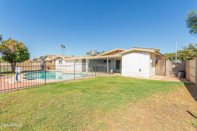 view of yard featuring a patio and a fenced in pool