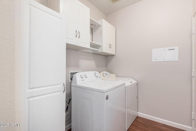 40713 N Courage Trl, Anthem, AZ 85086 - laundry area featuring independent washer and dryer, cabinet space, and dark wood-style floors
