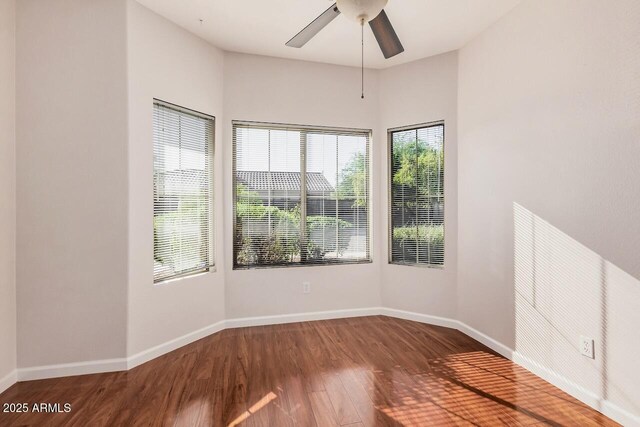40713 N Courage Trl, Anthem, AZ 85086 - spare room with wood finished floors and ceiling fan
