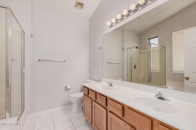 40713 N Courage Trl, Anthem, AZ 85086 - bathroom with a shower with shower door, double vanity, and tile patterned flooring