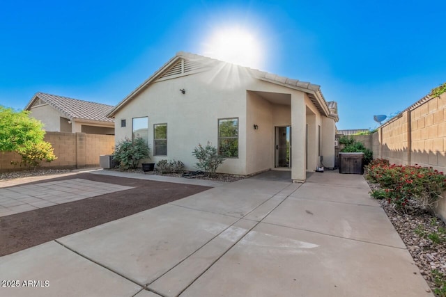 40713 N Courage Trl, Anthem, AZ 85086 - view of front facade featuring a patio area, a fenced backyard, and stucco siding