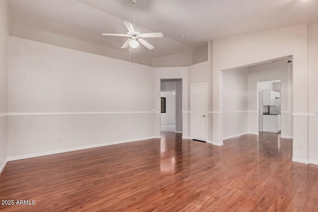 40713 N Courage Trl, Anthem, AZ 85086 - spare room with ceiling fan, wood finished floors, and vaulted ceiling