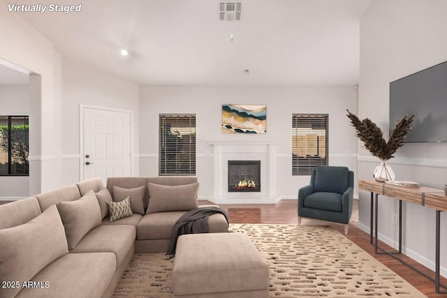 40713 N Courage Trl, Anthem, AZ 85086 - living room with wood finished floors and a glass covered fireplace