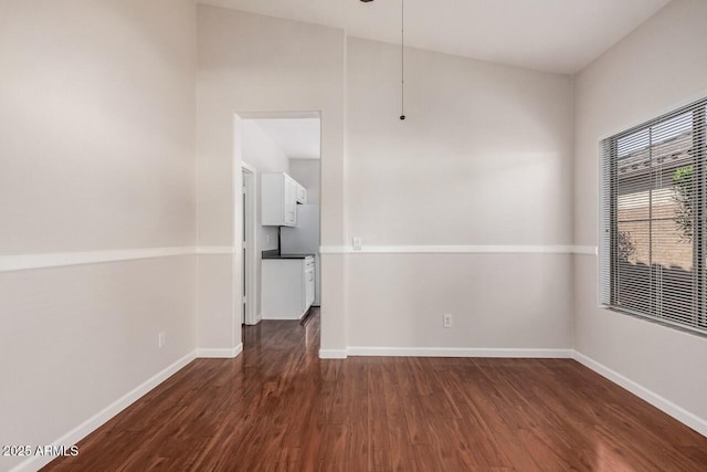 40713 N Courage Trl, Anthem, AZ 85086 - empty room with dark wood-style flooring and baseboards