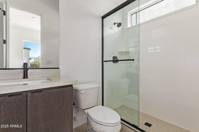 full bathroom featuring a stall shower and toilet