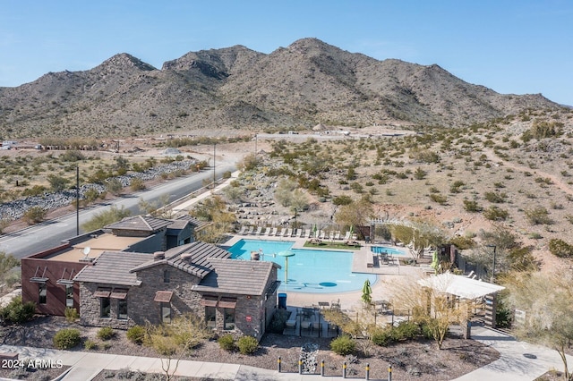 birds eye view of property featuring a mountain view