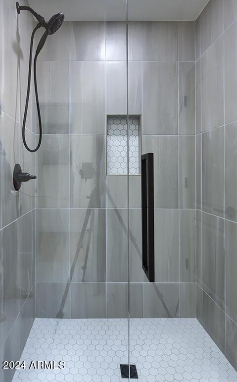 bathroom featuring an enclosed shower