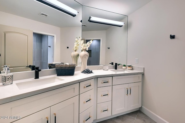 bathroom with tile patterned flooring and vanity