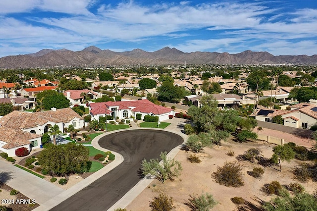 birds eye view of property with a mountain view