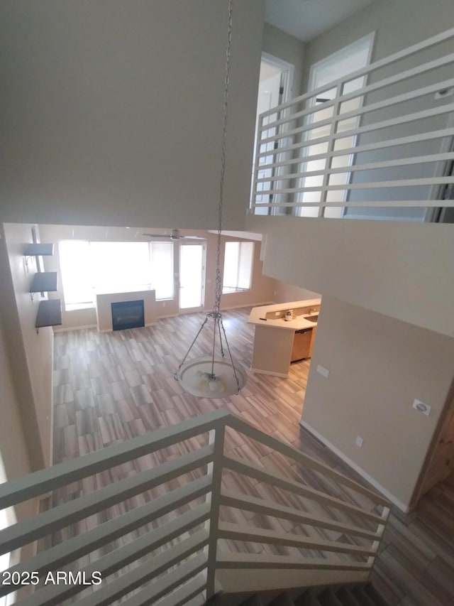 interior space featuring a high ceiling and a fireplace
