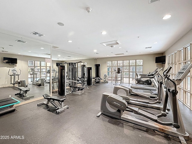 exercise room with visible vents and recessed lighting