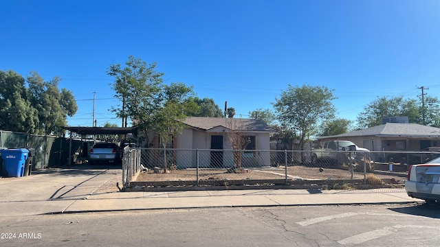 view of front of property with a carport