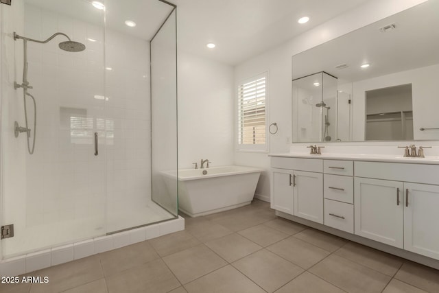 22568 E Rosa Rd, Queen Creek, AZ 85142 - bathroom with a shower stall, double vanity, a soaking tub, tile patterned floors, and recessed lighting