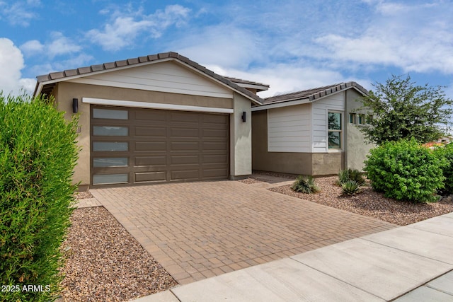 22568 E Rosa Rd, Queen Creek, AZ 85142 - ranch-style home featuring decorative driveway, stucco siding, a tiled roof, and an attached garage