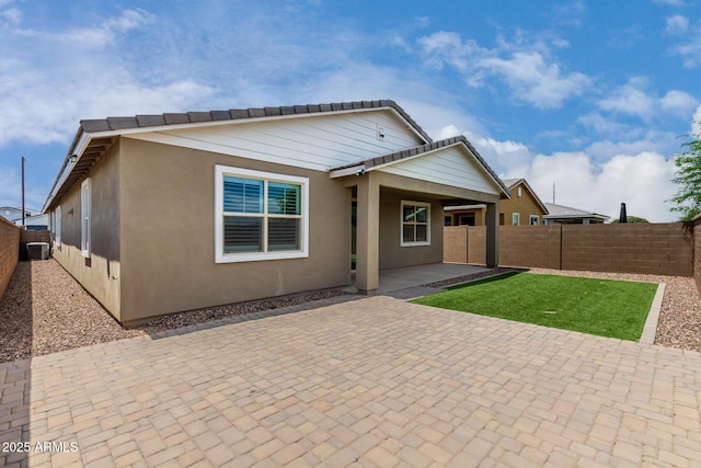 22568 E Rosa Rd, Queen Creek, AZ 85142 - back of property featuring a fenced backyard, a patio, and stucco siding