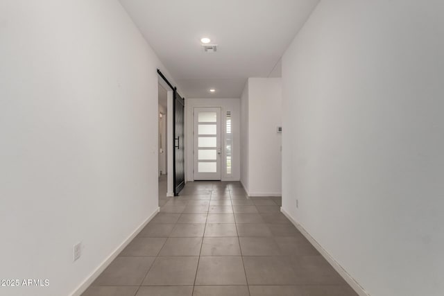 22568 E Rosa Rd, Queen Creek, AZ 85142 - hallway featuring a barn door, baseboards, recessed lighting, and light tile patterned flooring