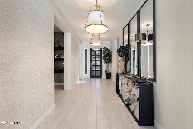 hall with light hardwood / wood-style floors