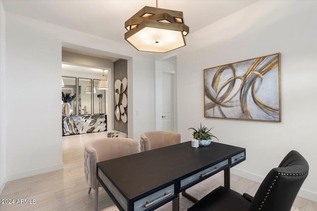 dining area with light hardwood / wood-style floors