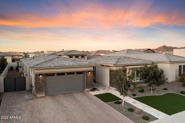 prairie-style home featuring a garage