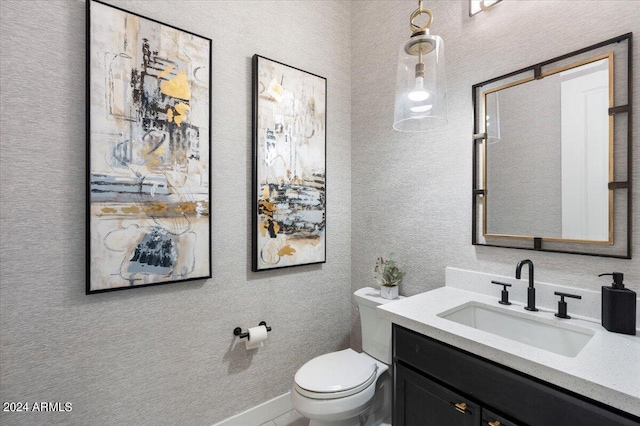 bathroom with vanity and toilet