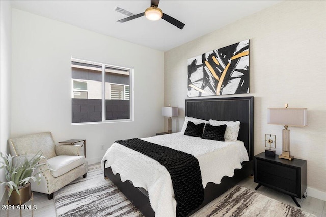 bedroom featuring hardwood / wood-style flooring and ceiling fan