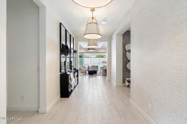 hall with light hardwood / wood-style floors