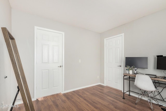 office space with baseboards and wood finished floors