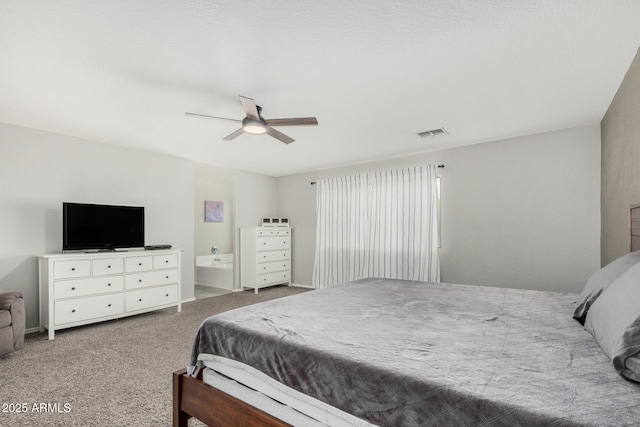 carpeted bedroom featuring ceiling fan and visible vents