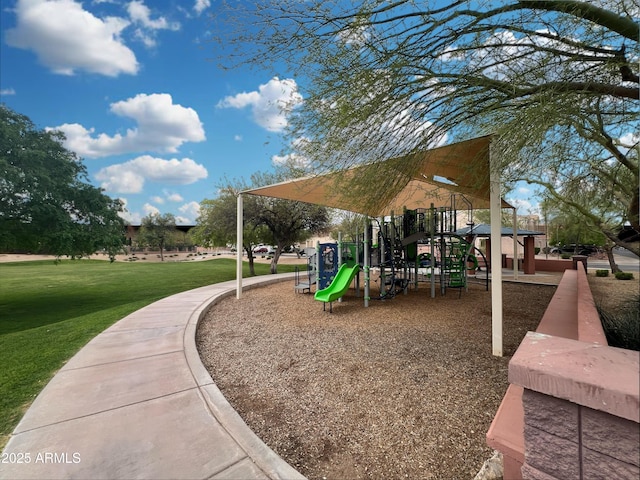 communal playground featuring a yard