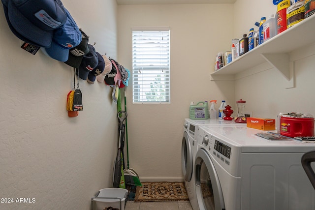 laundry area with tile patterned flooring and separate washer and dryer