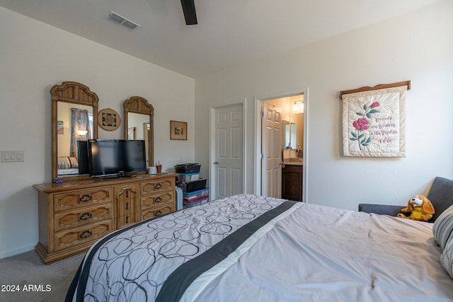 carpeted bedroom featuring ceiling fan and connected bathroom