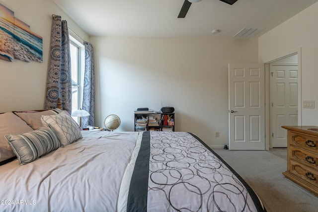 bedroom with light colored carpet and ceiling fan