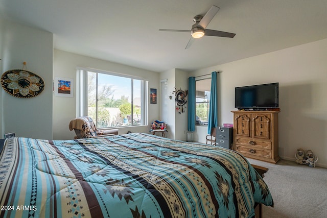 bedroom with ceiling fan and carpet floors