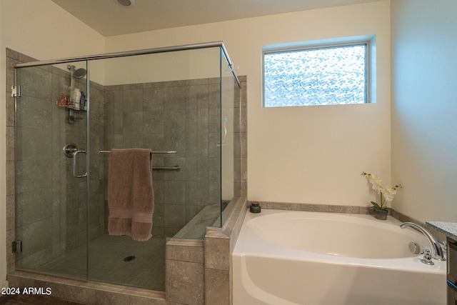 bathroom with shower with separate bathtub