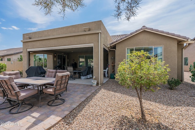 back of house featuring a patio area