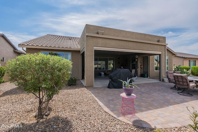 rear view of house with a patio