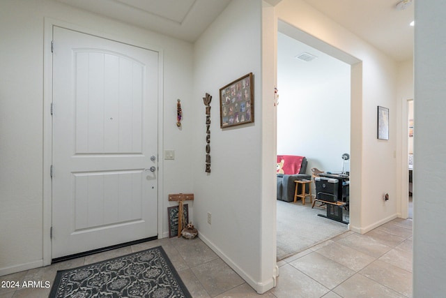 entrance foyer featuring light tile patterned flooring