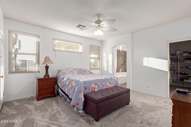 bedroom featuring carpet, visible vents, ceiling fan, and a spacious closet