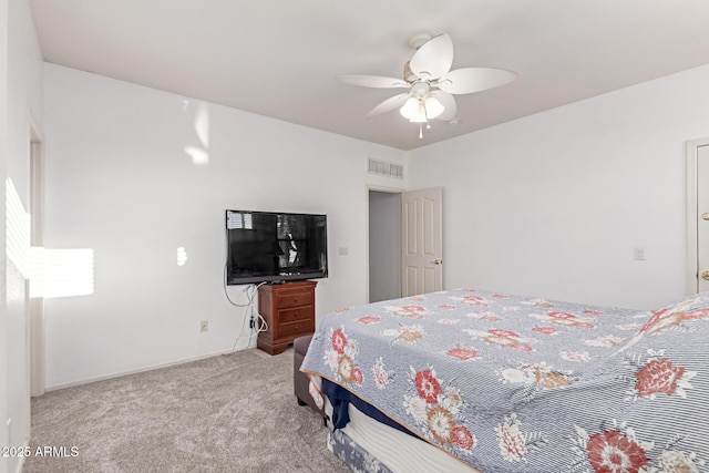 bedroom with carpet floors, visible vents, baseboards, and a ceiling fan