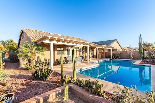 view of swimming pool featuring a patio area, fence, a fenced in pool, and a pergola